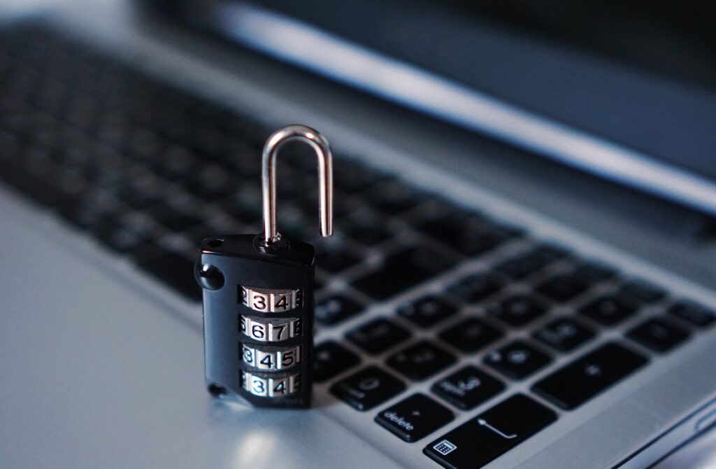 A photo of a laptop with a padlock denoting cyber security.